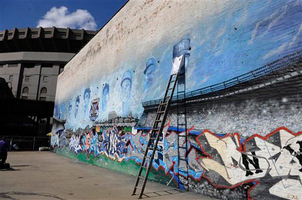 Bobby Murcer's image is added to a mural of Yankee greats, near the old stadium.  